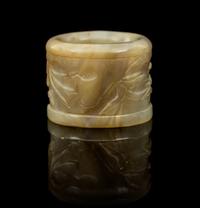 A Carved Jade Archer's Ring Diameter 1 3/8 inches.