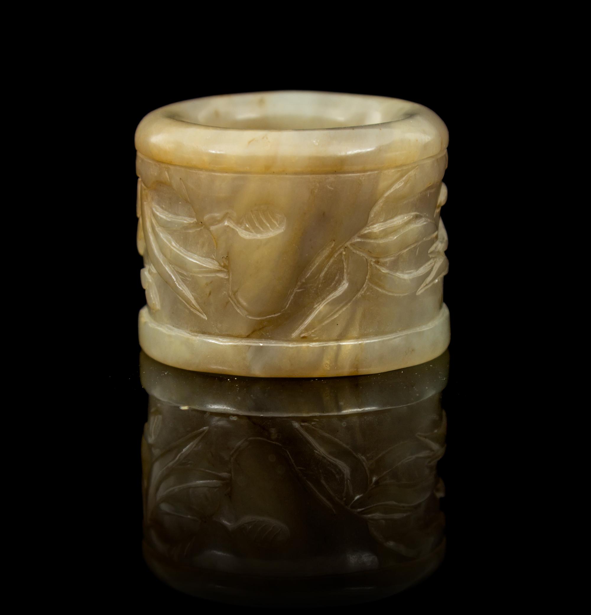 A Carved Jade Archer's Ring Diameter 1 3/8 inches.