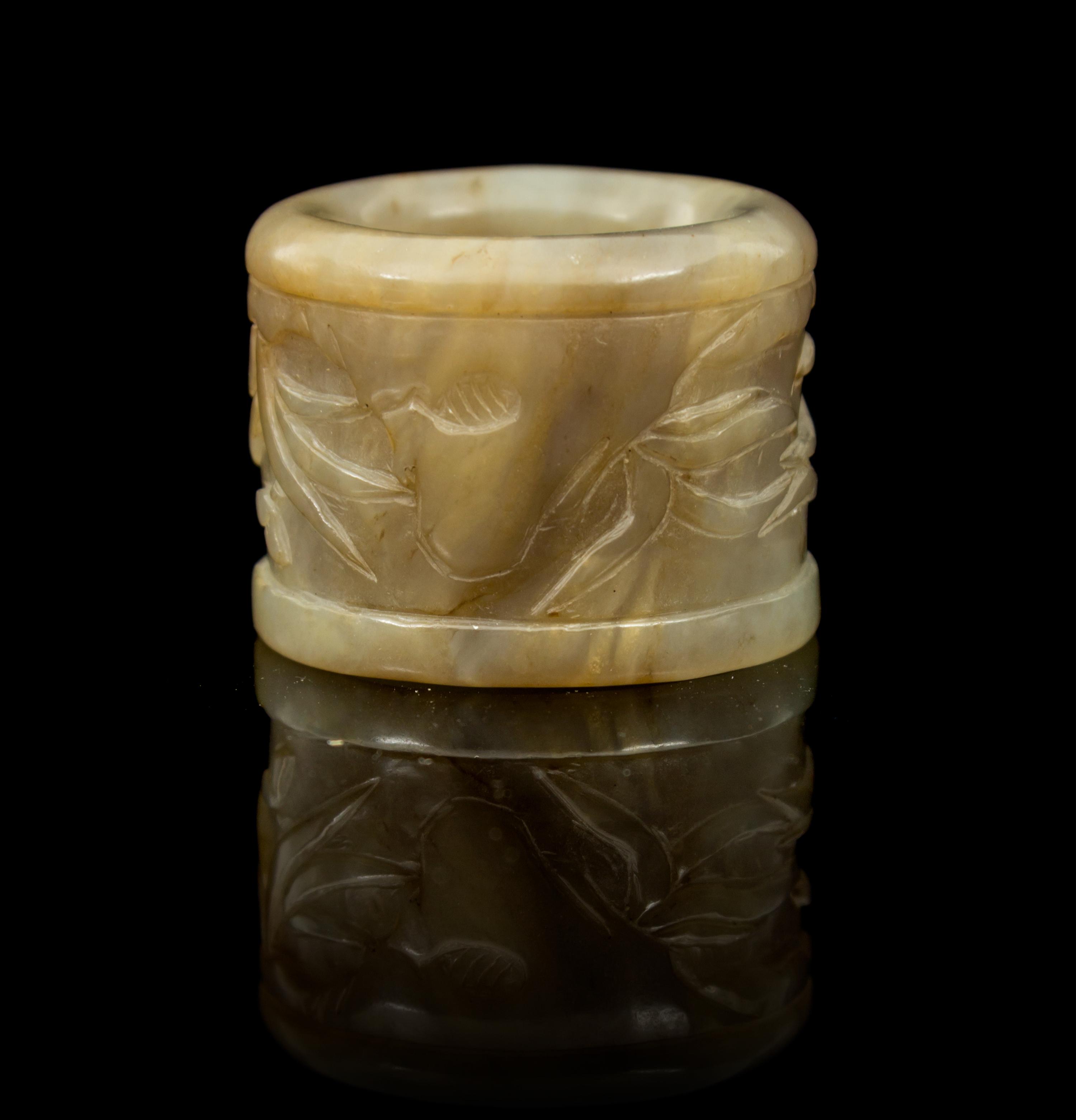 A Carved Jade Archer's Ring Diameter 1 3/8 inches.