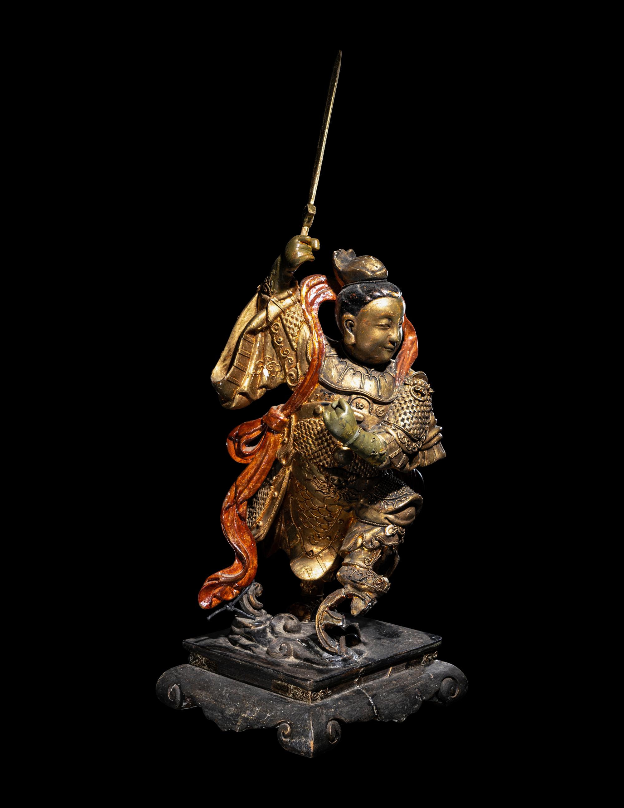 A Gilt and Lacquered Wood Figure of a Guardian