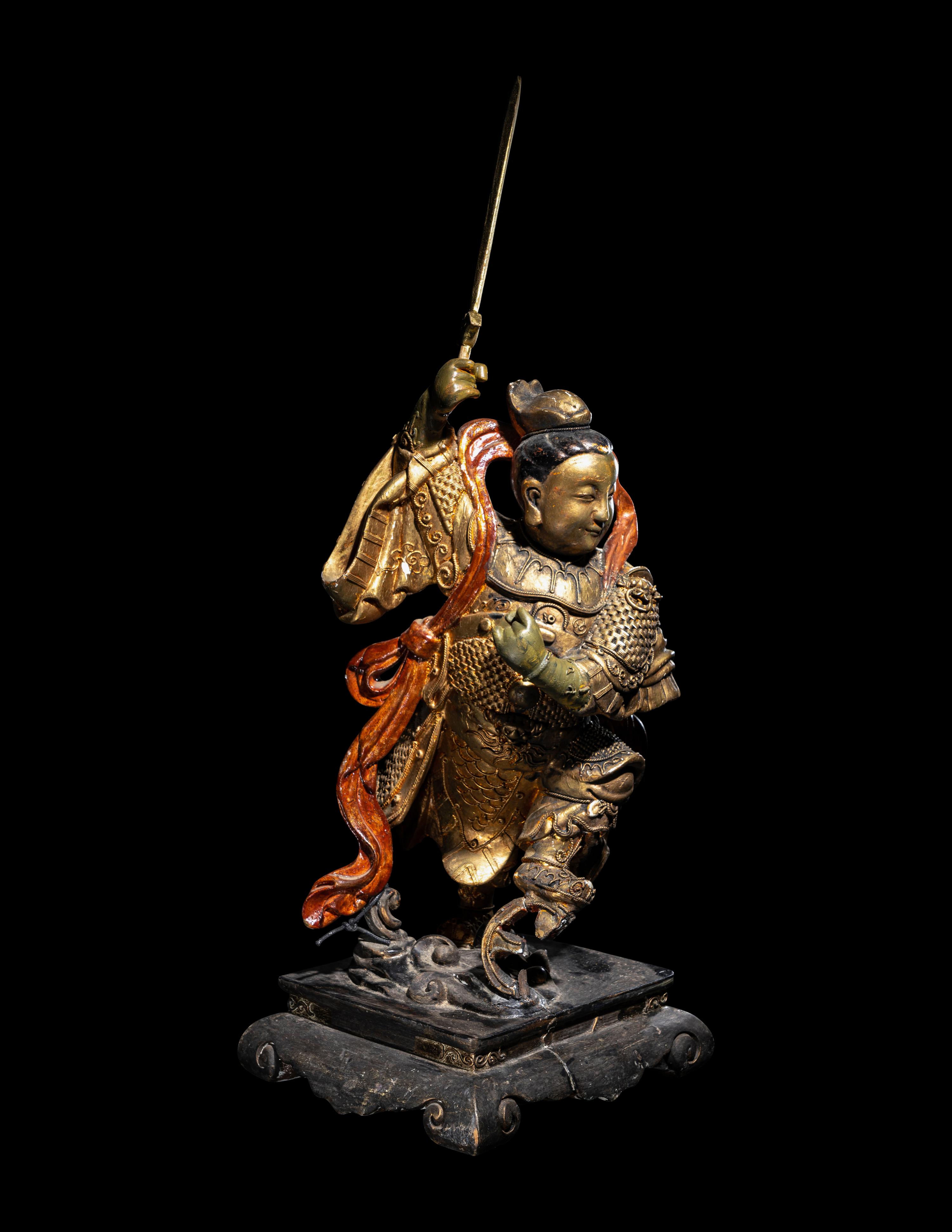 A Gilt and Lacquered Wood Figure of a Guardian