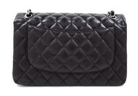 A Chanel Black Quilted Lambskin Jumbo Double Flap Bag, 8.25" H x 12" W x 3.5" D; Strap drop: 13.5"- 23.75".