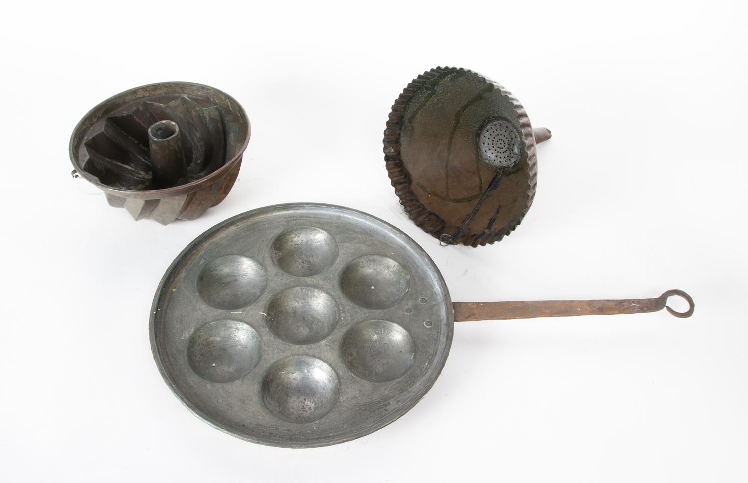 A Set of Three Copper Kitchen Utensils Width of largest 21 1/2 inches.