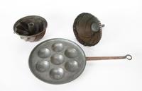 A Set of Three Copper Kitchen Utensils Width of largest 21 1/2 inches.