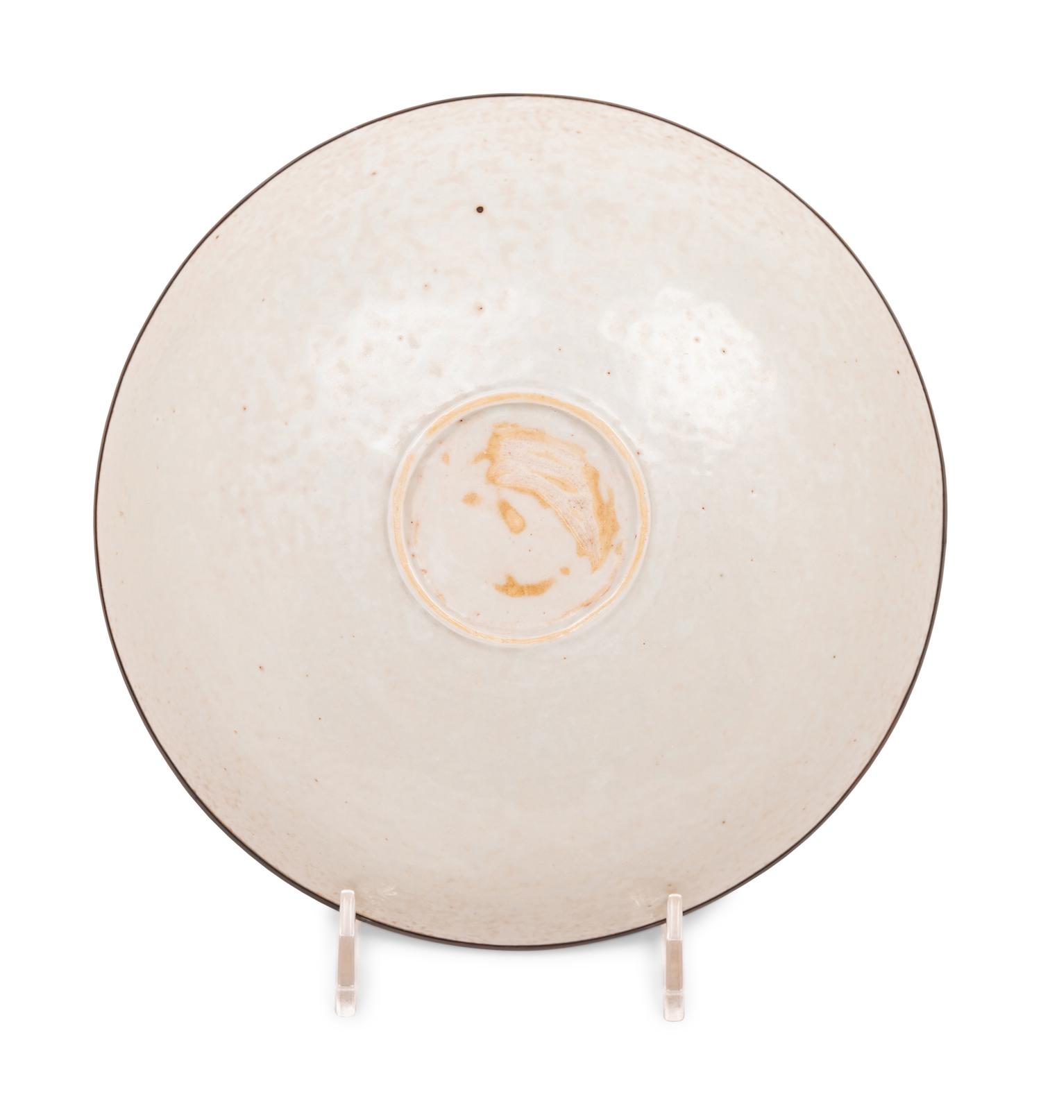 A Chinese Dingyao Style White Glazed Molded Porcelain Bowl