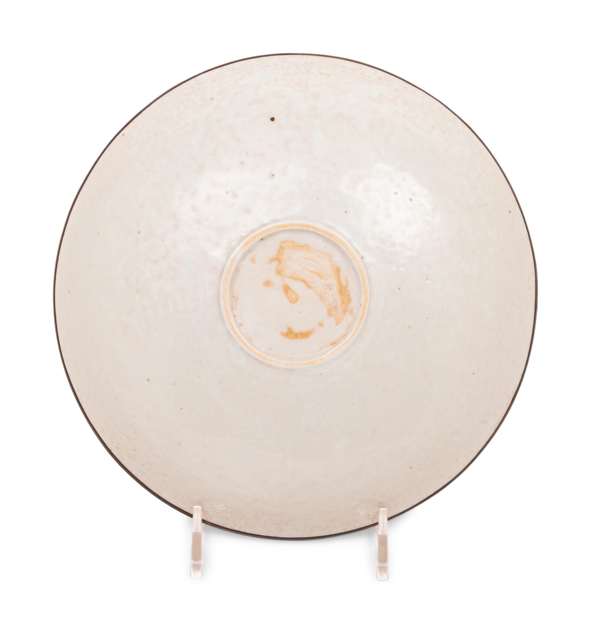 A Chinese Dingyao Style White Glazed Molded Porcelain Bowl