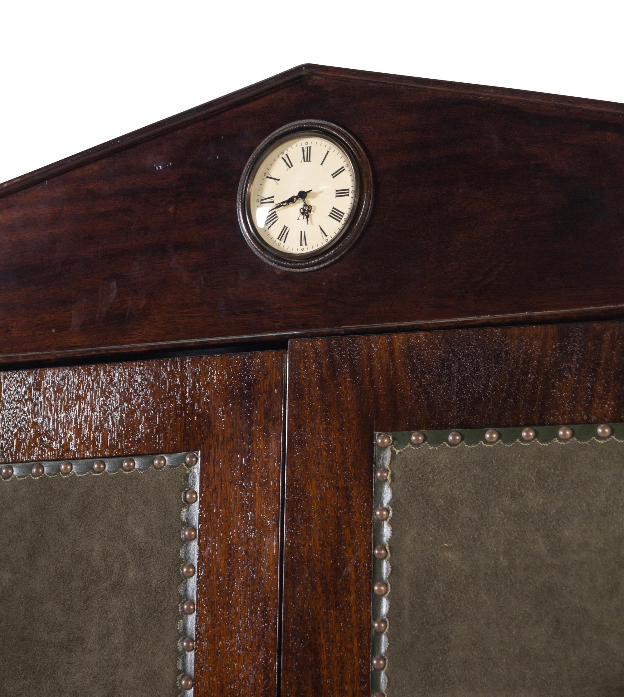 A Regency Style Suede-Inset Mahogany Armoire