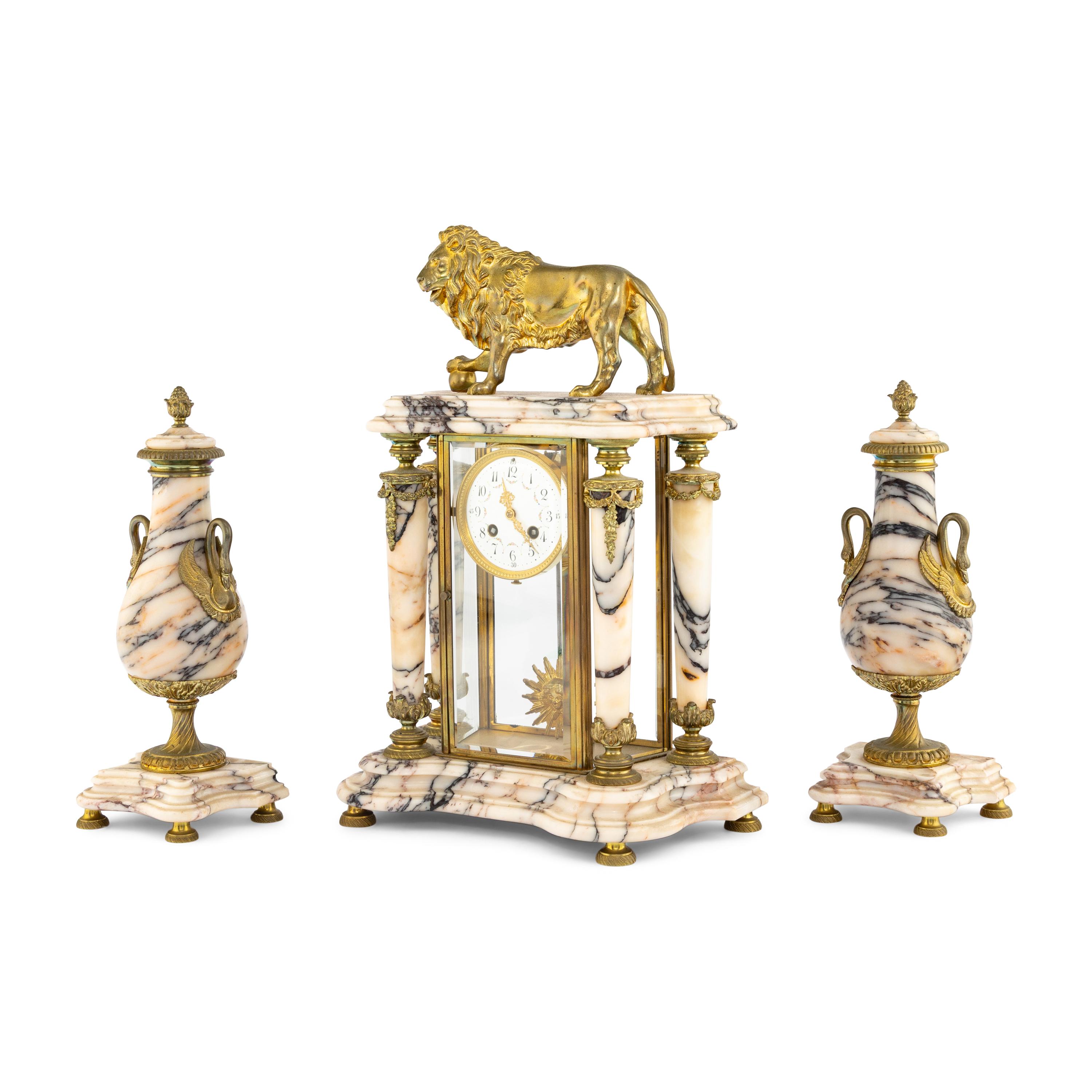 A French Gilt Bronze and Marble Clock Garniture