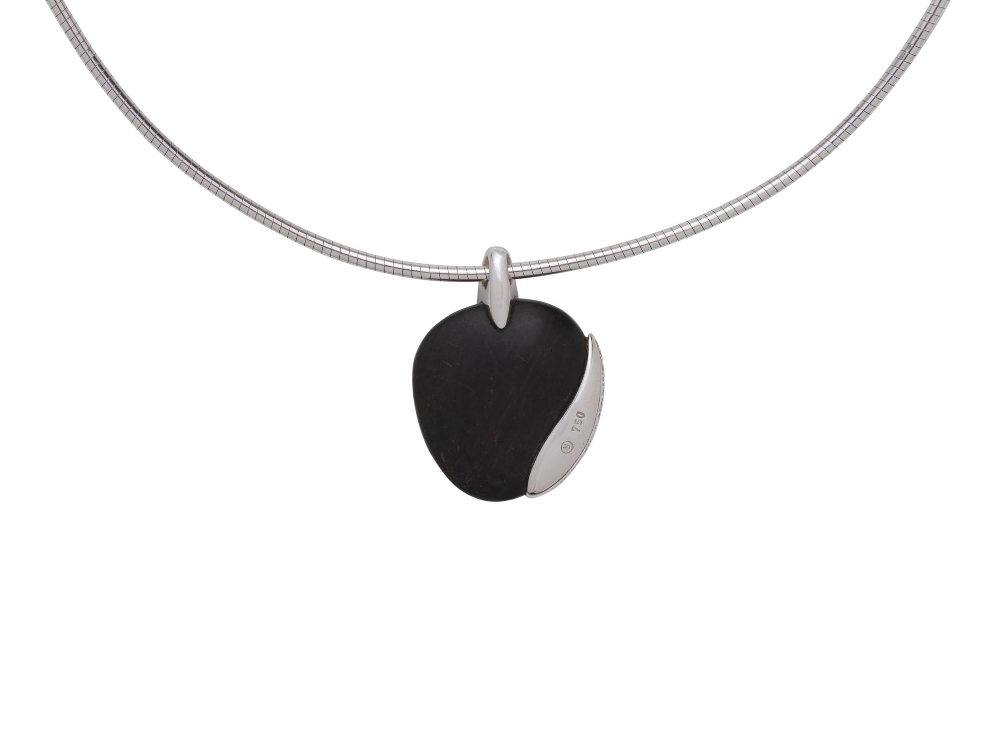 MOVADO, WHITE GOLD, PEBBLE AND DIAMOND SET