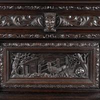 An Italian Renaissance Revival Carved Oak Bureau Cabinet on Stand