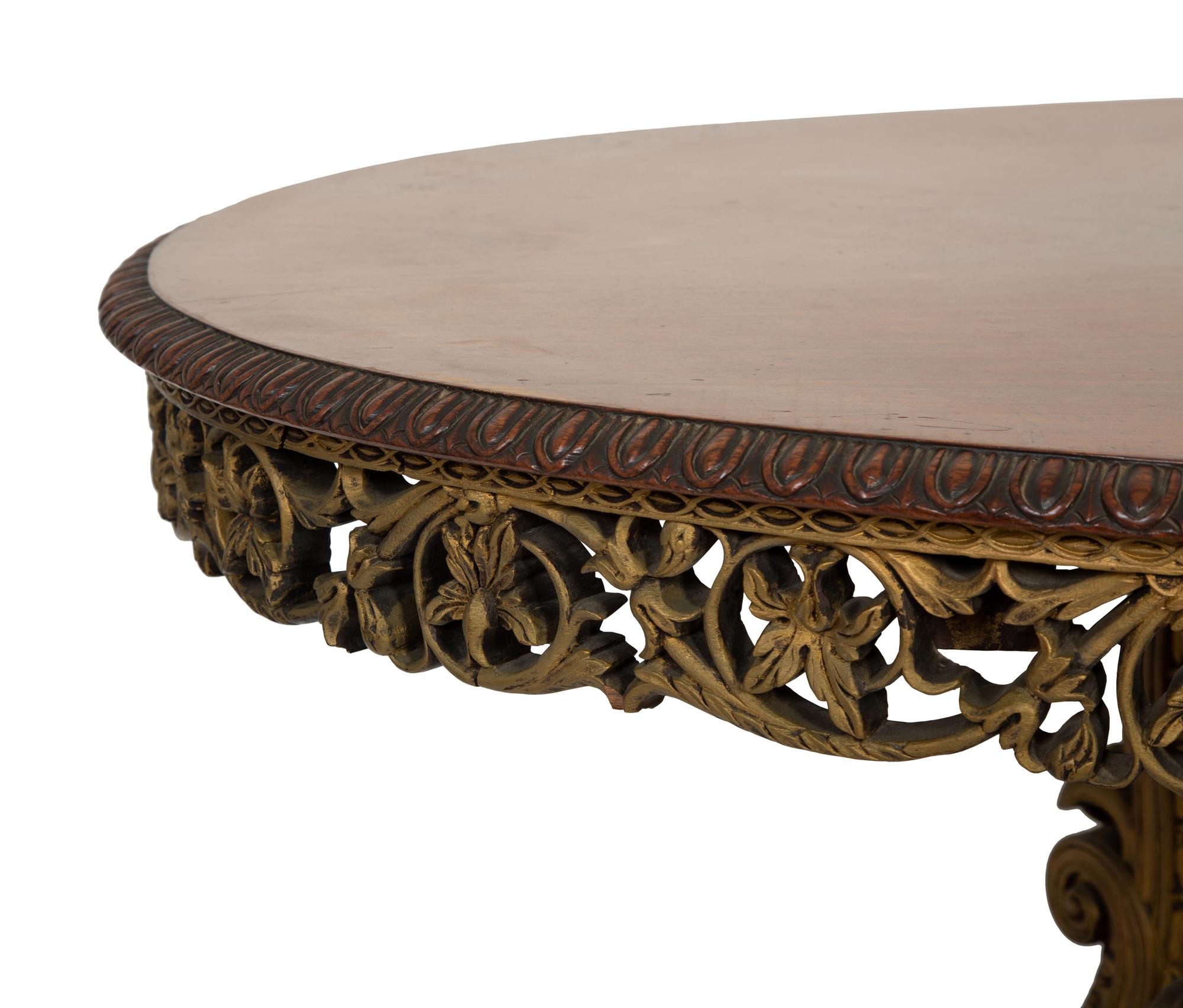 An Anglo-Indian Carved and Parcel Gilt Tilt-Top Table with Lion Form Feet