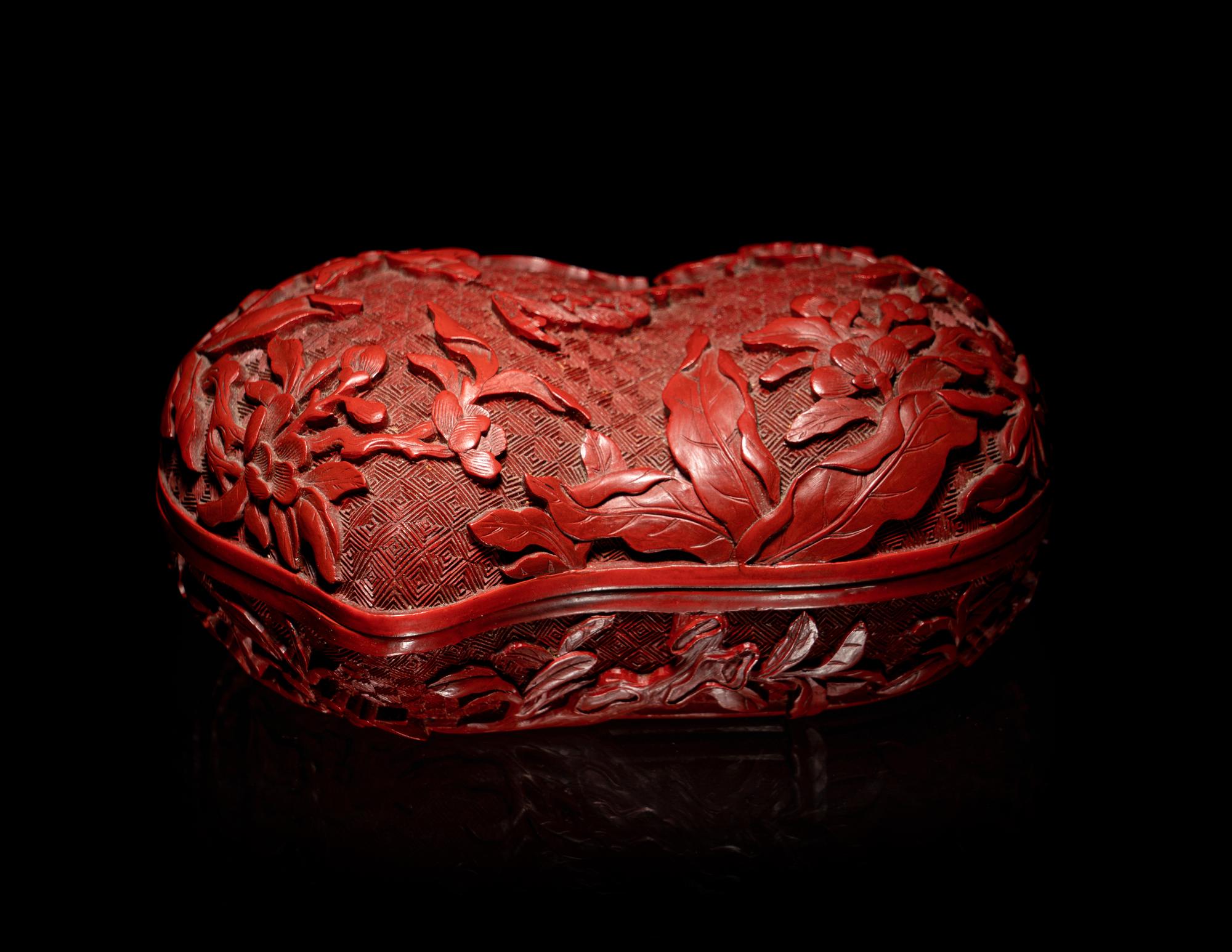 A Chinese Cinnabar Lacquer Double-Peach Form Box and Cover