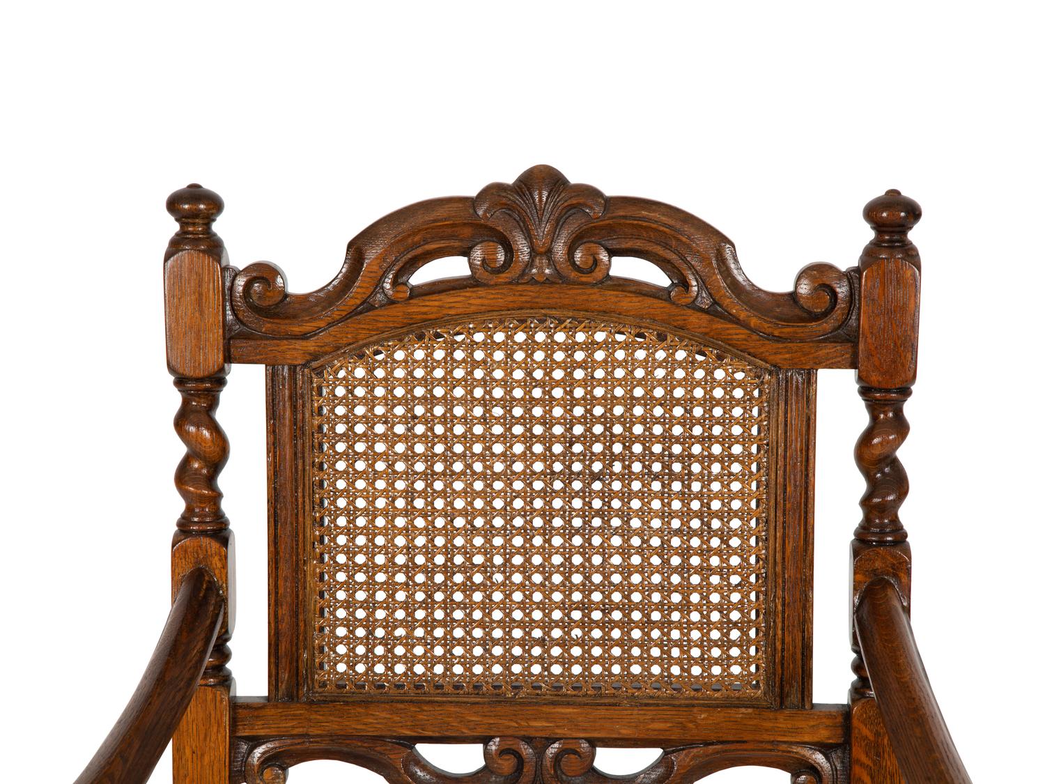 A William and Mary Style Carved Oak Cane Back Armchair