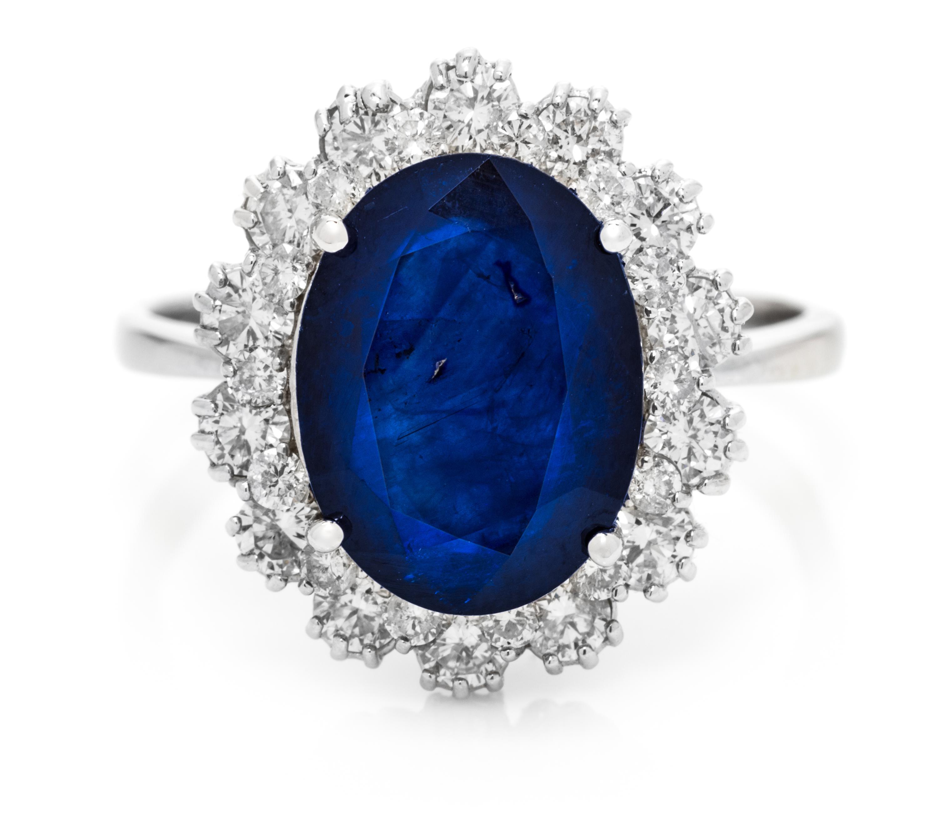 A 14 Karat White Gold, Sapphire and Diamond Ring, 4.20 dwts.
