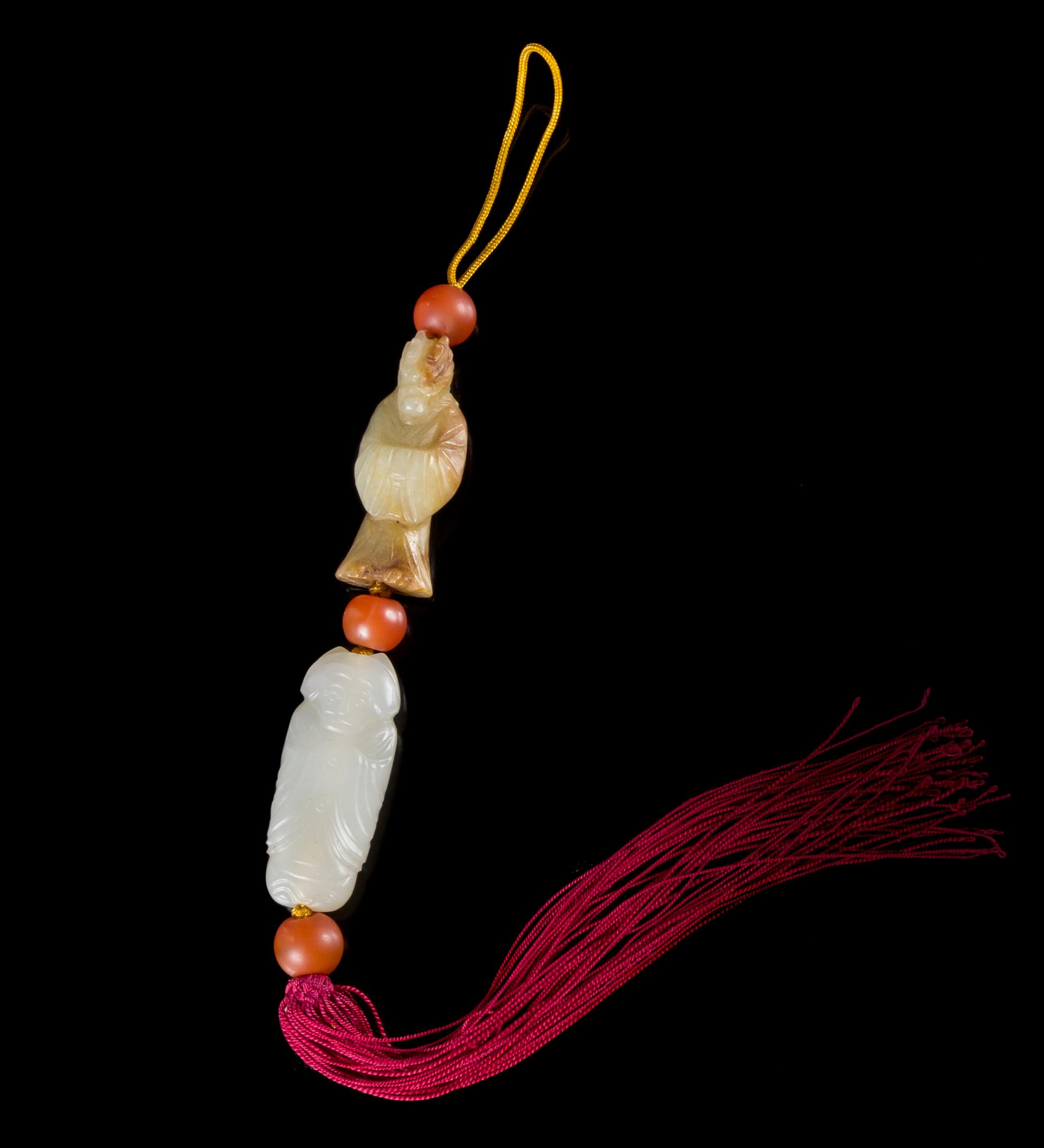 Two Jade Pendants Length of larger 1 3/4 inches.