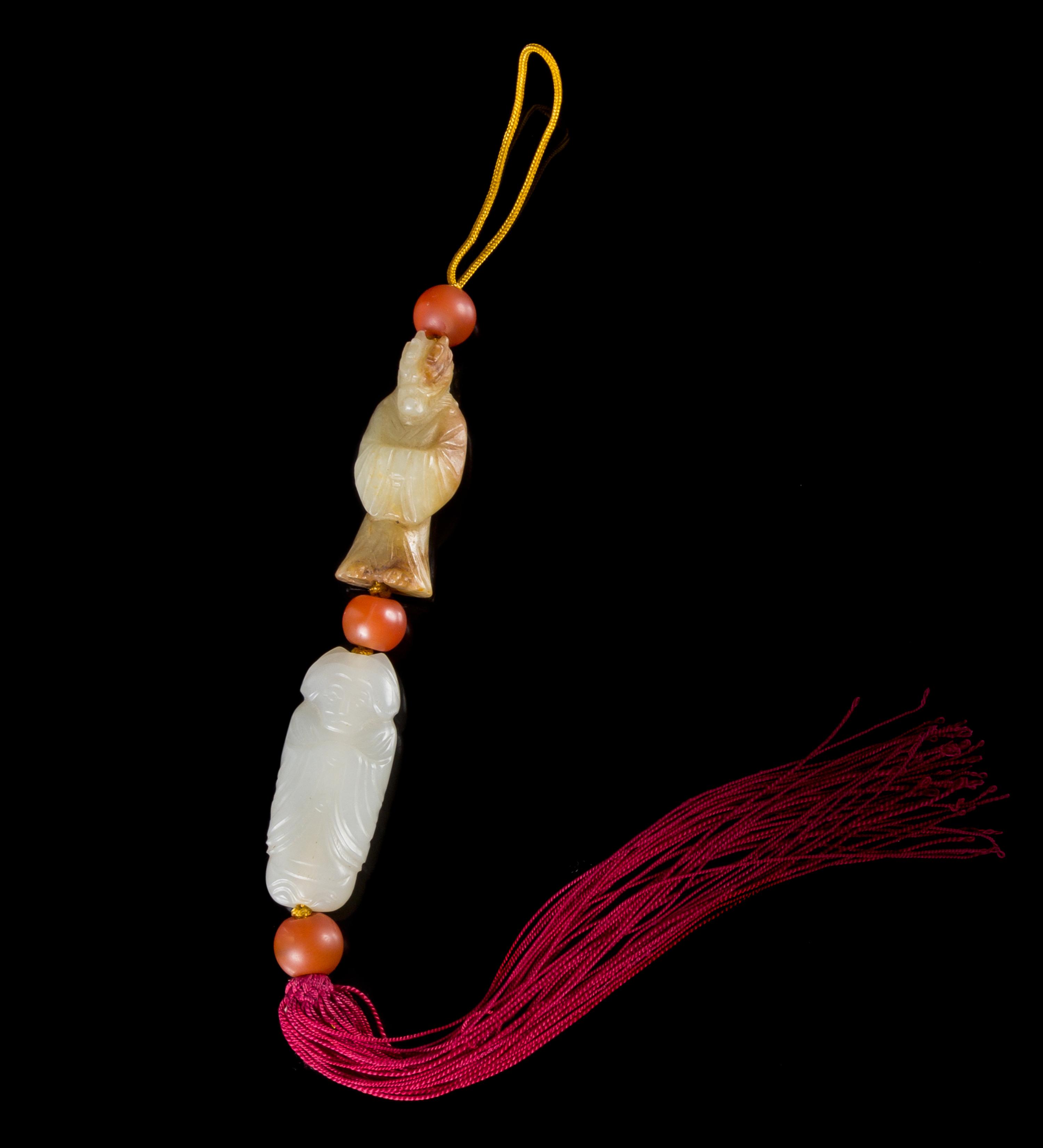 Two Jade Pendants Length of larger 1 3/4 inches.