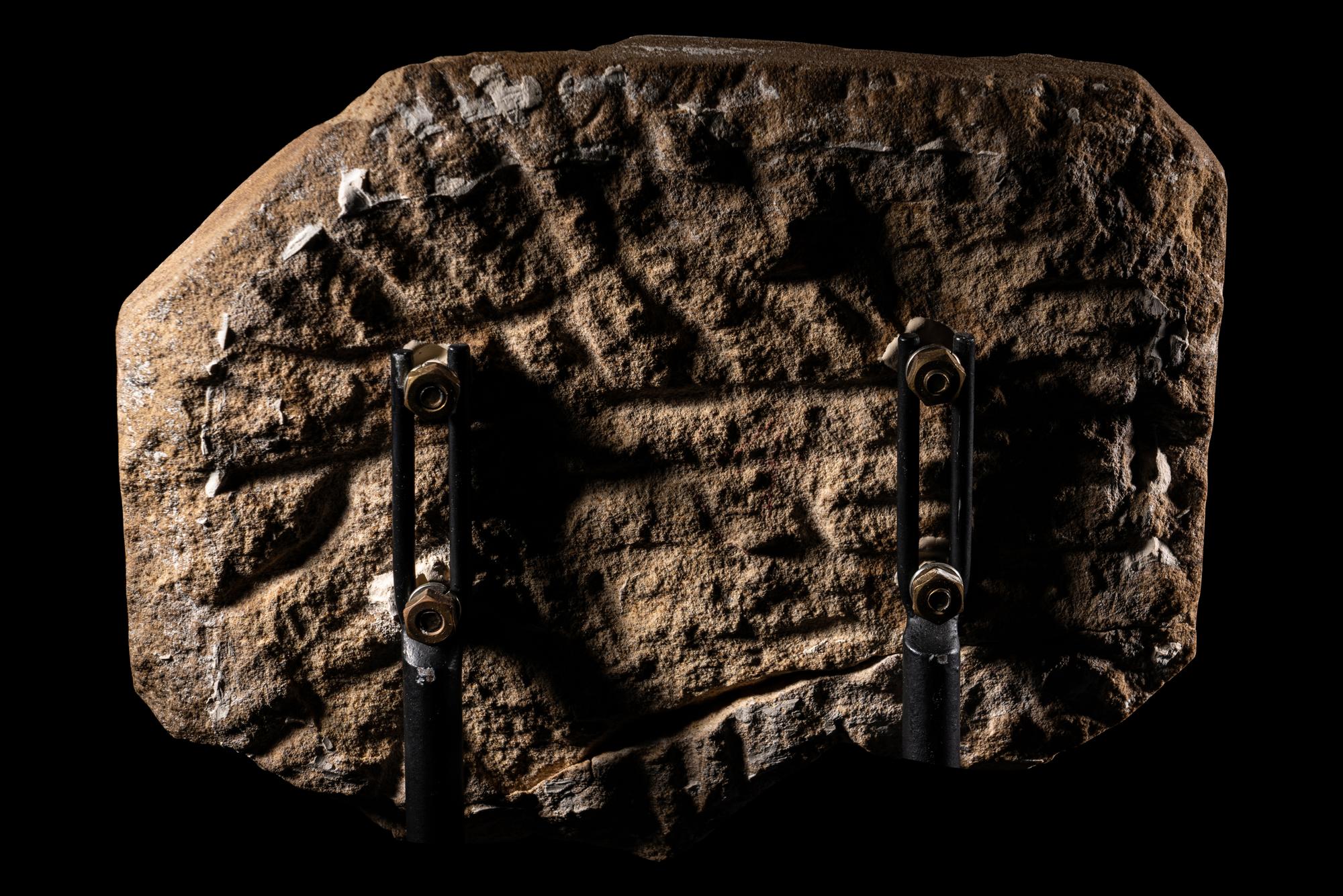An Egyptian Painted Sandstone Relief Fragment