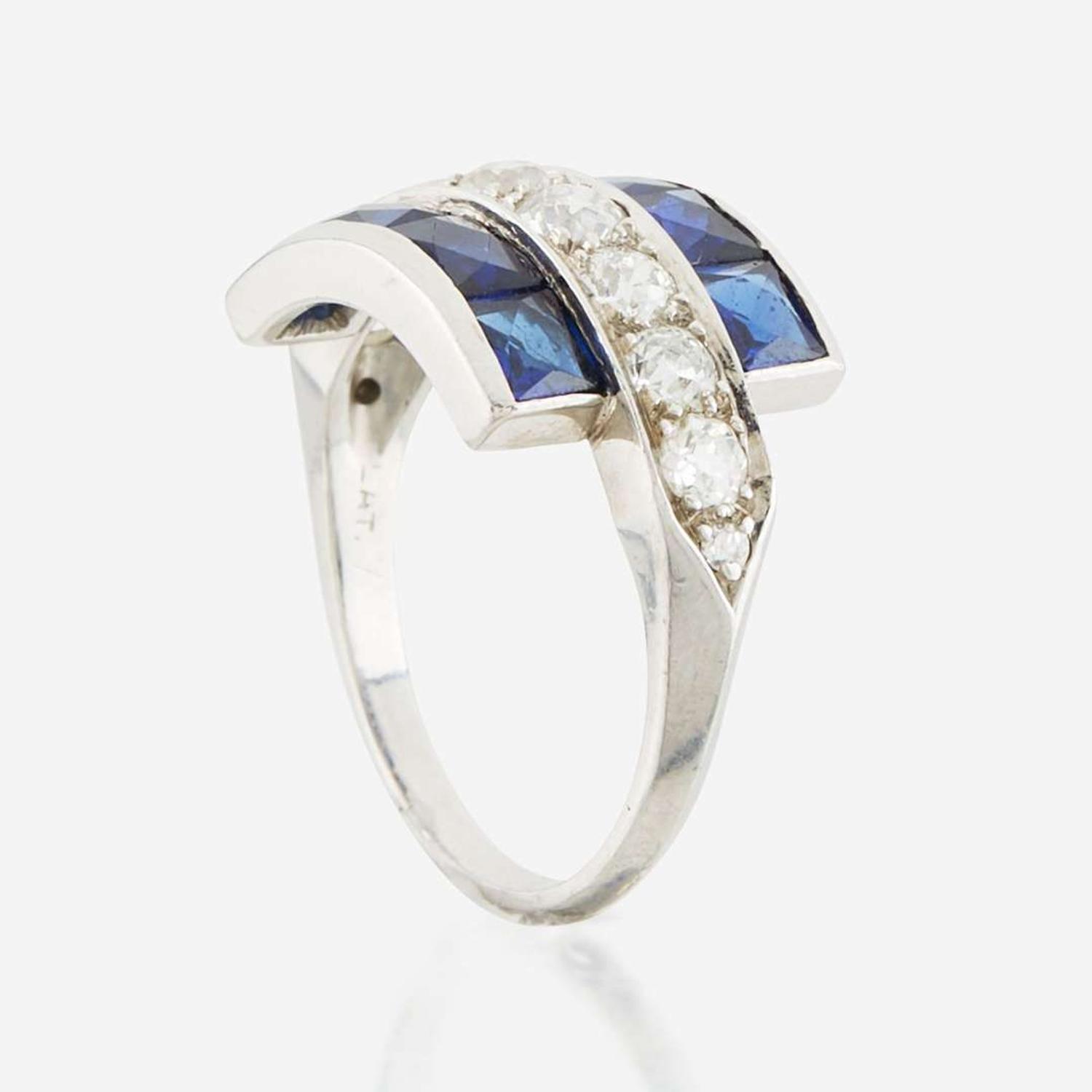 A diamond, blue glass, and platinum ring