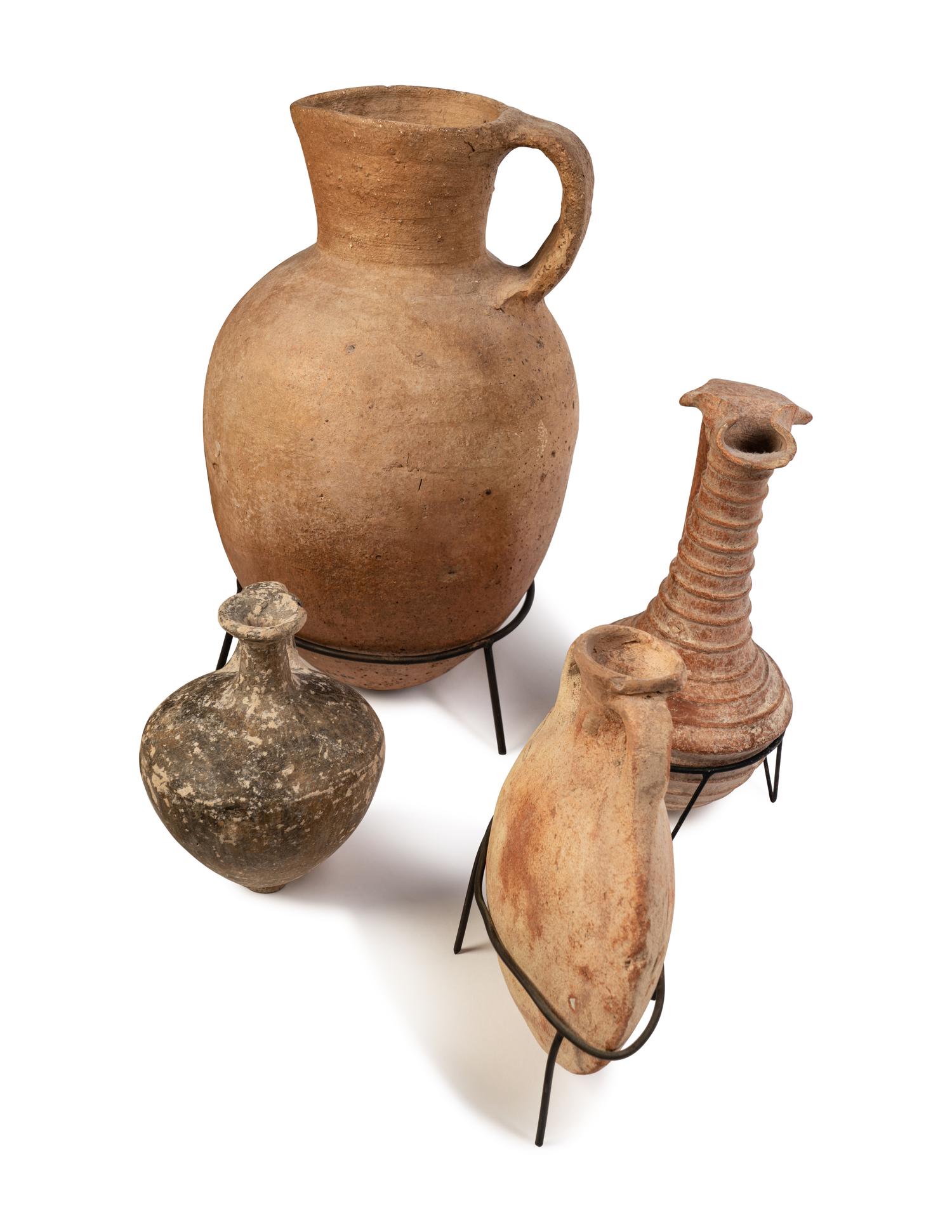 A Group of 19 Holy Land Terracotta Oil Lamps, Pottery, and Bronze Blades