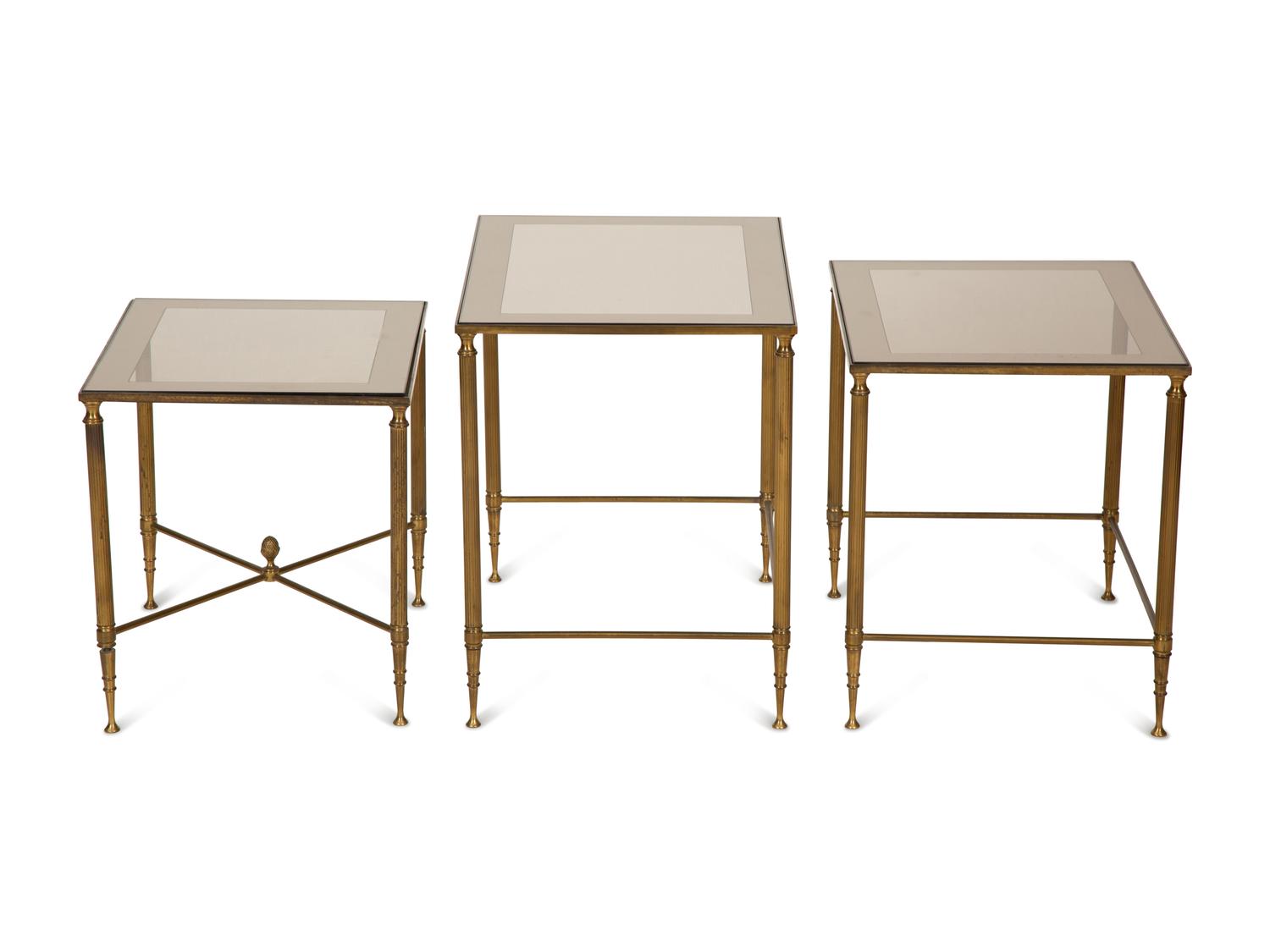 A Set of Three Gilt Metal Nesting Tables in the Style of Maison Jansen