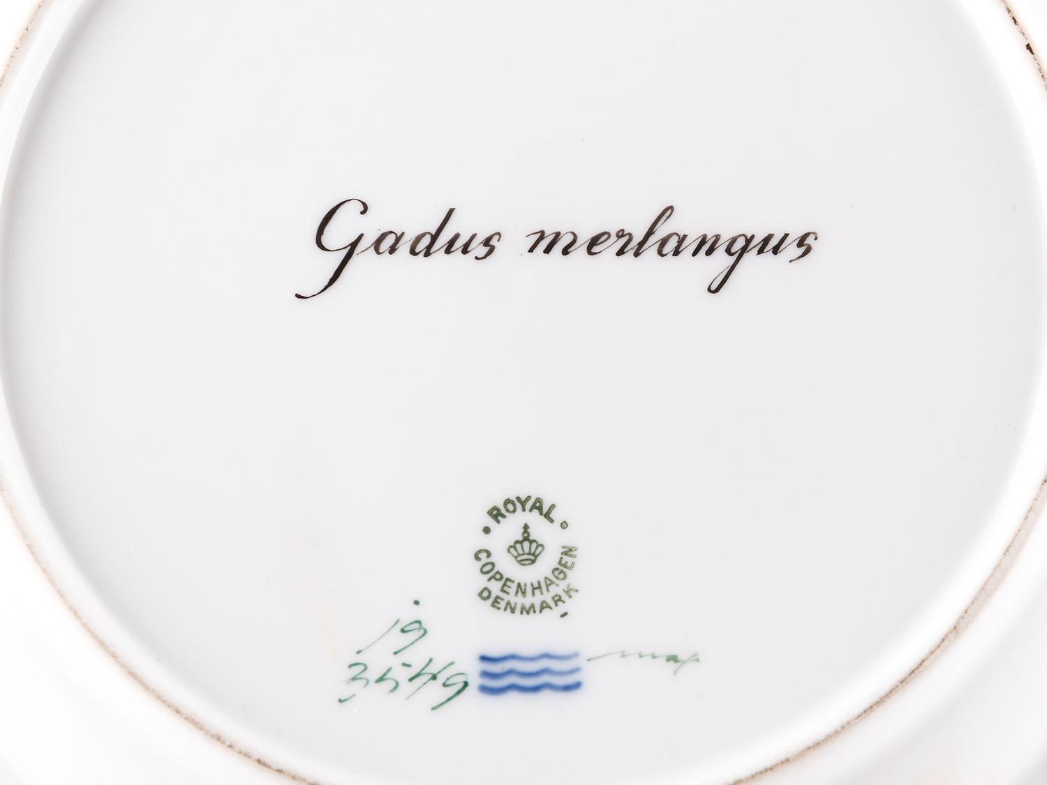 A Set of Twelve Royal Copenhagen Parcel Gilt Porcelain Fish Plates