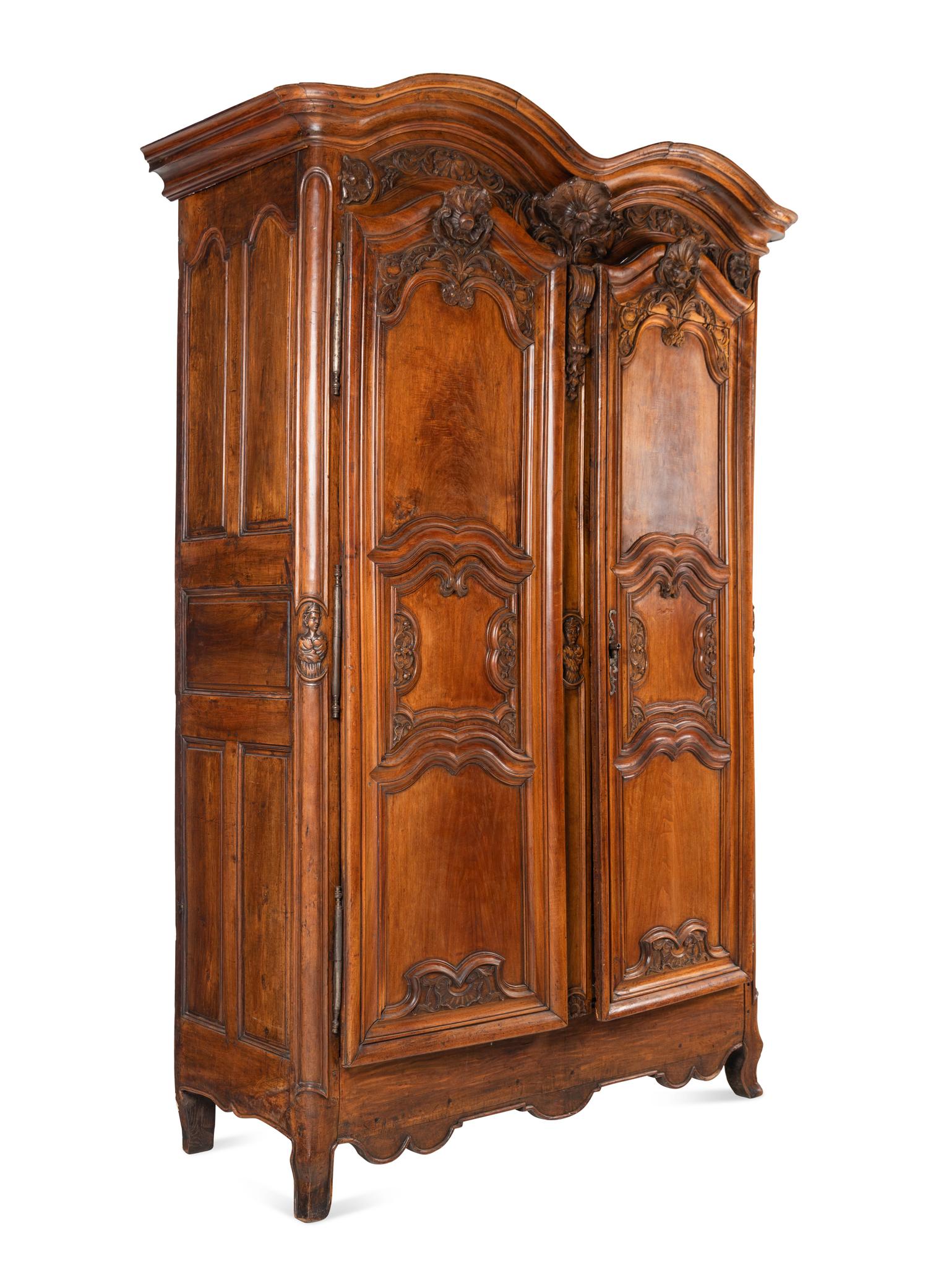 A Louis XV Carved Walnut Armoire