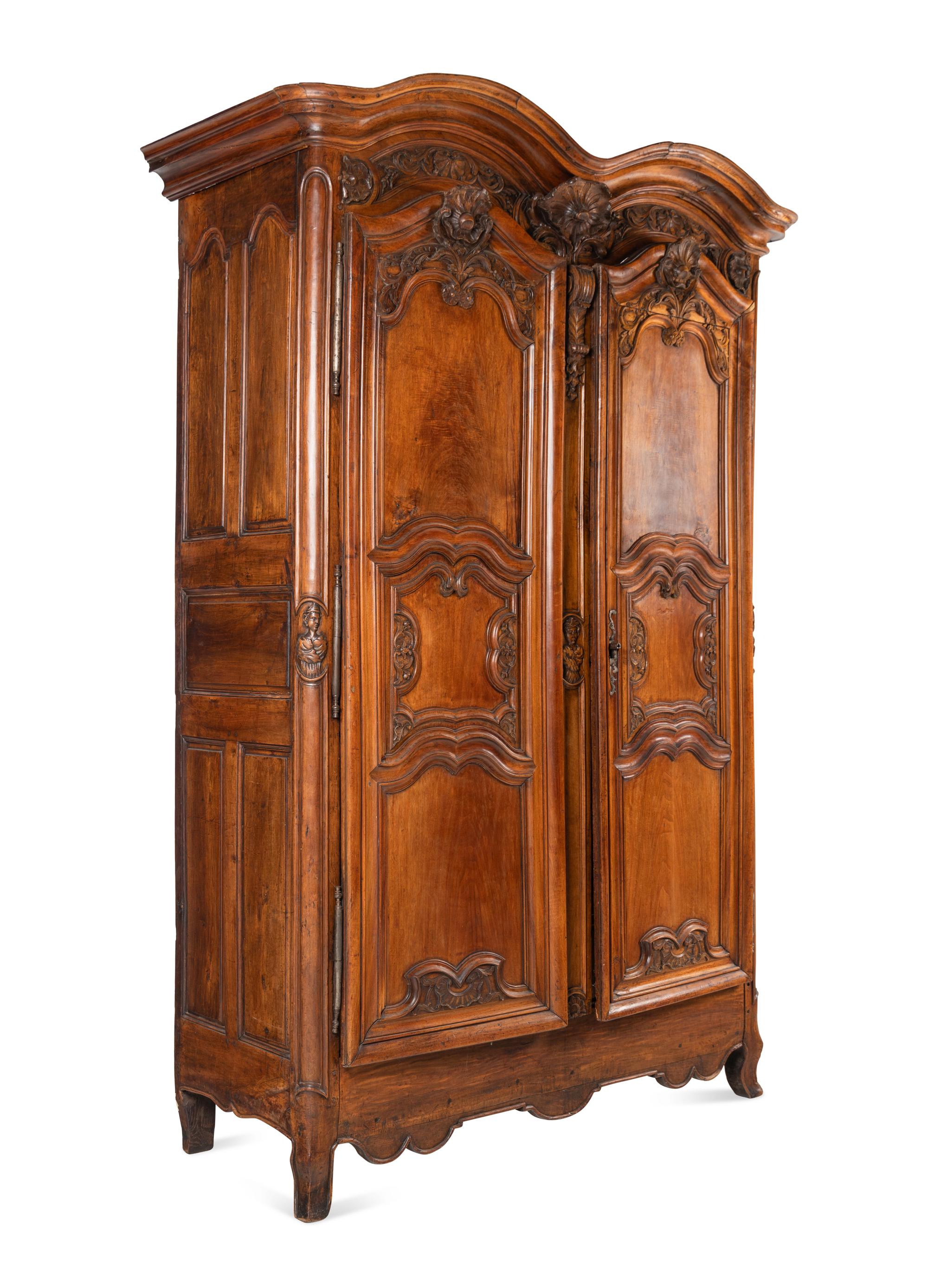 A Louis XV Carved Walnut Armoire