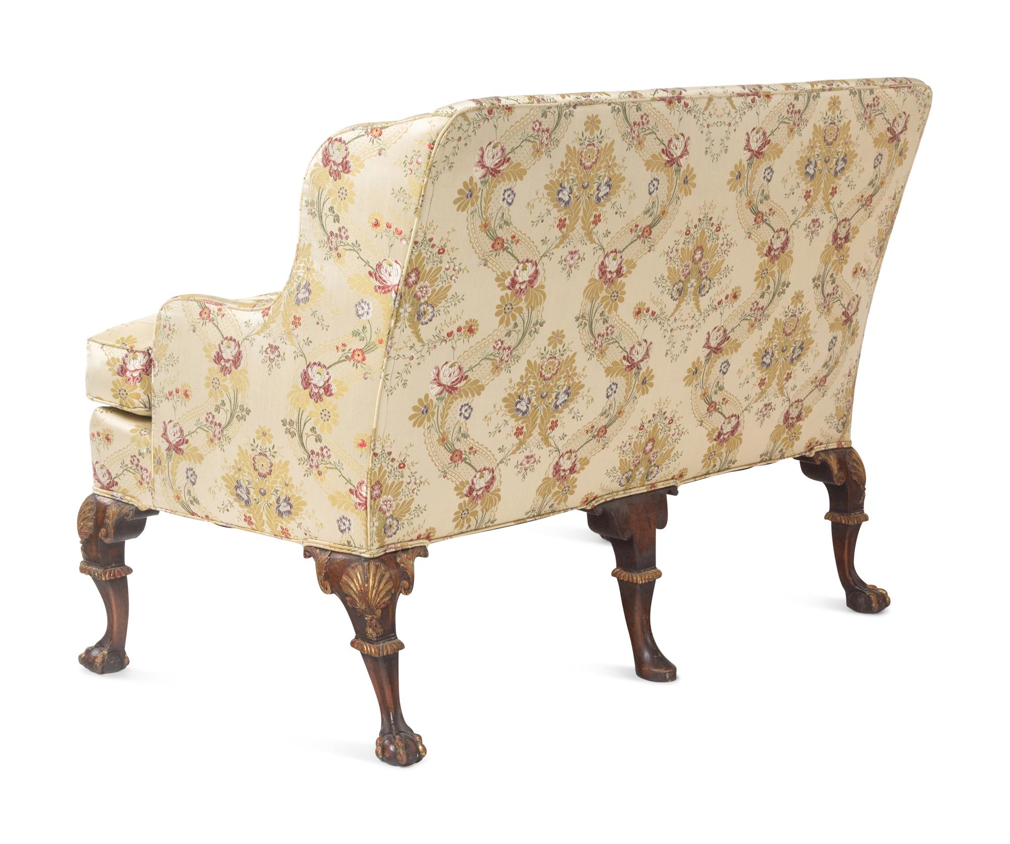 A Pair of George II Style Parcel-Gilt Walnut Settees