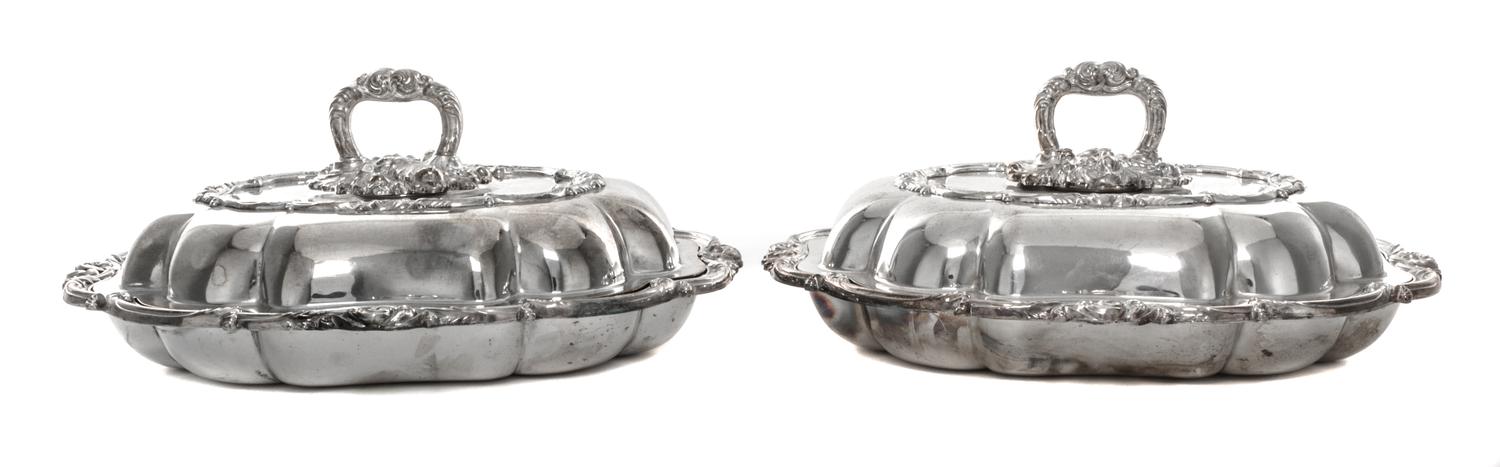 A Pair of Silver-Plate Covered Entree Dishes, 20th Century, each with foliate cast handle and border, unmarked.