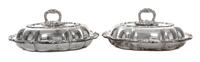 A Pair of Silver-Plate Covered Entree Dishes, 20th Century, each with foliate cast handle and border, unmarked.