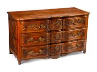 A Louis XV Provincial Carved Walnut Commode