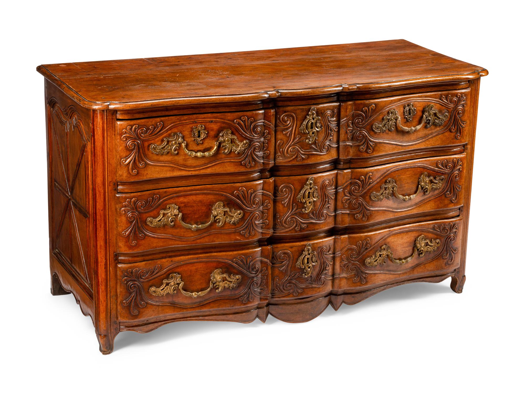 A Louis XV Provincial Carved Walnut Commode