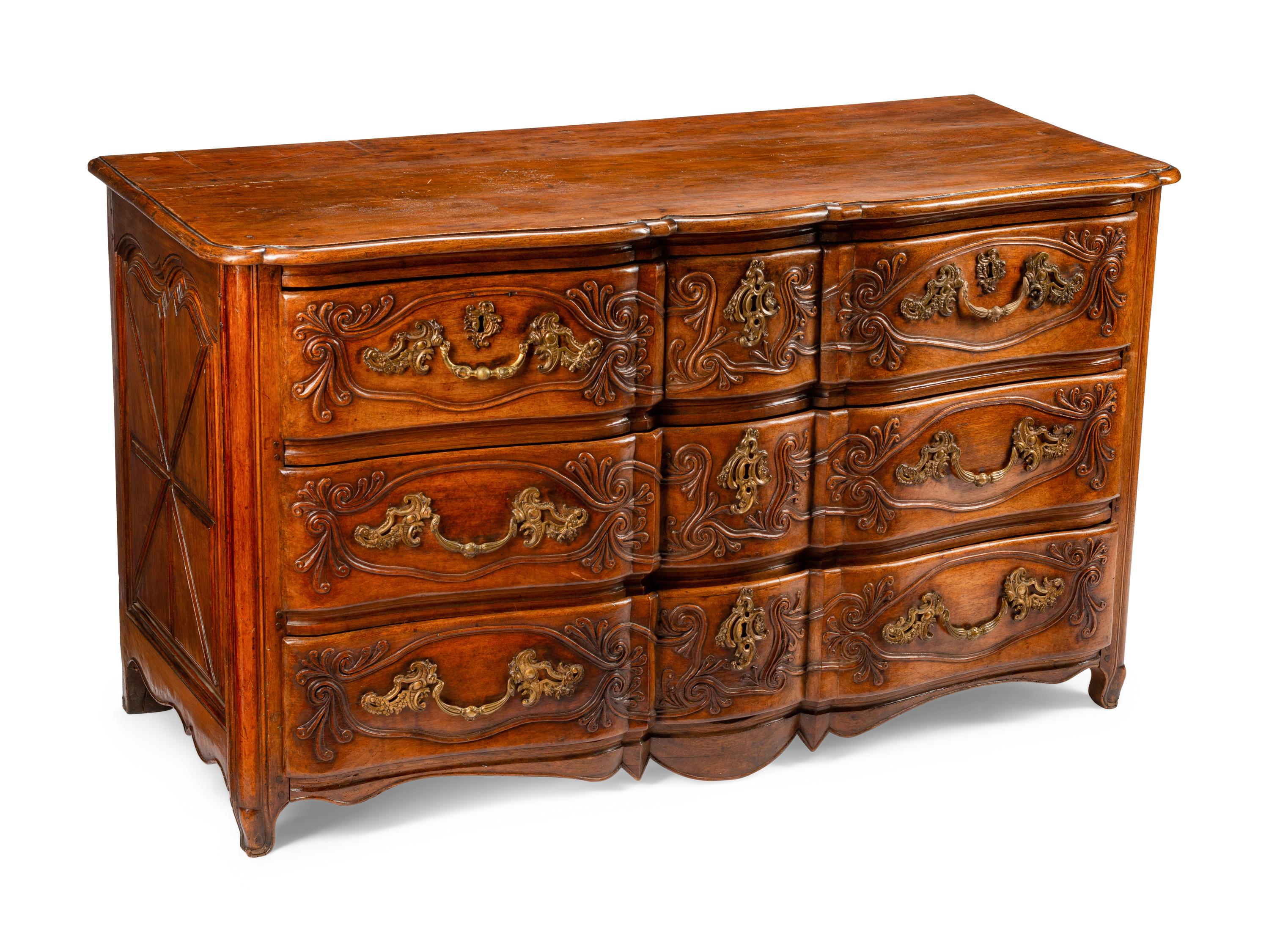 A Louis XV Provincial Carved Walnut Commode