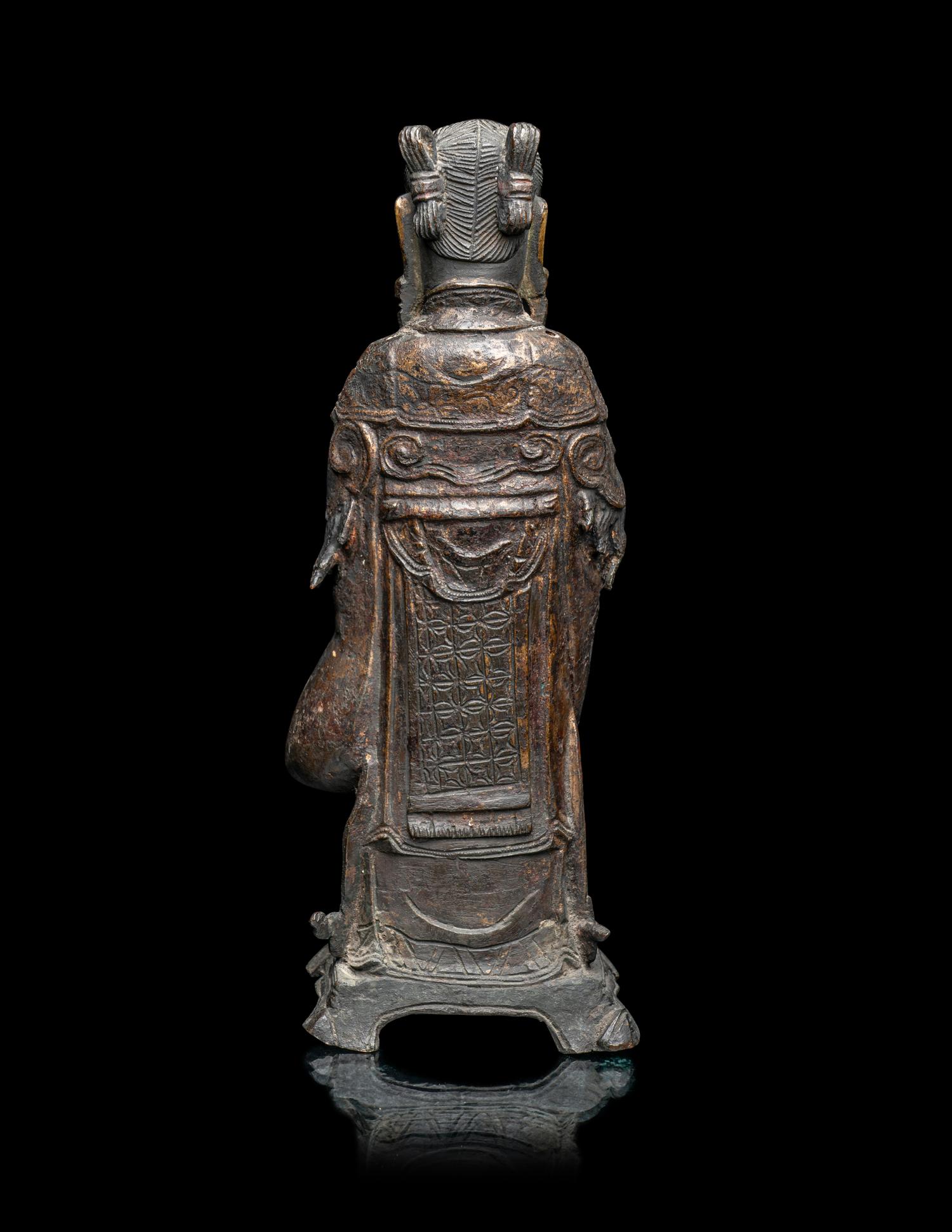 A Chinese Parcel-Gilt Bronze Figure of a Daoist Immortal, Longnv