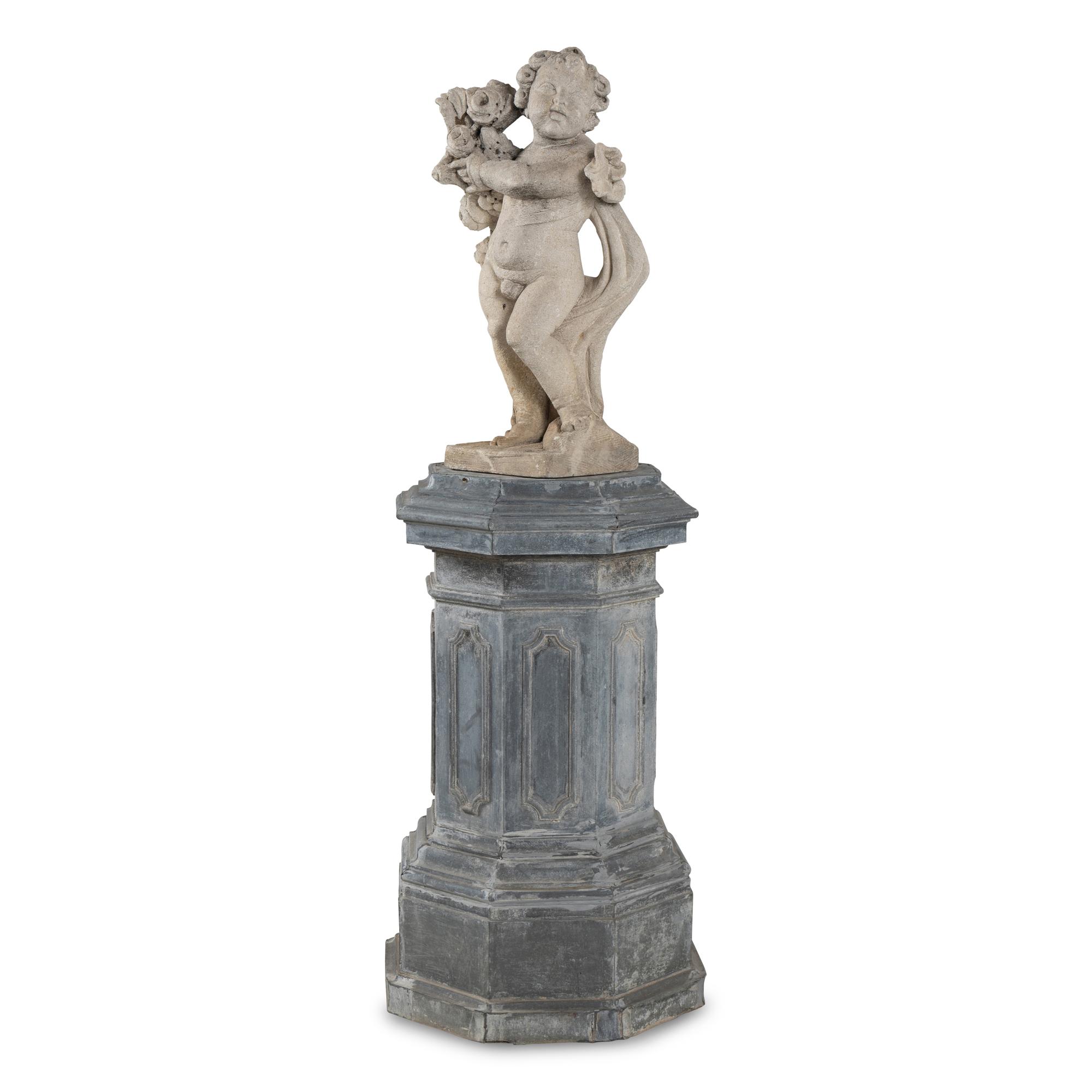 A Cast Stone Garden Figure of a Putto on a Zinc Pedestal