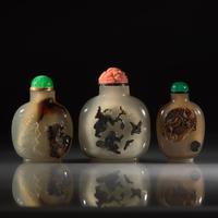 Three Chinese Carved "Shadow Agate" Snuff Bottles, 18th/19th Century and Later — 清中期及以後 瑪瑙巧雕鼻煙壺三支