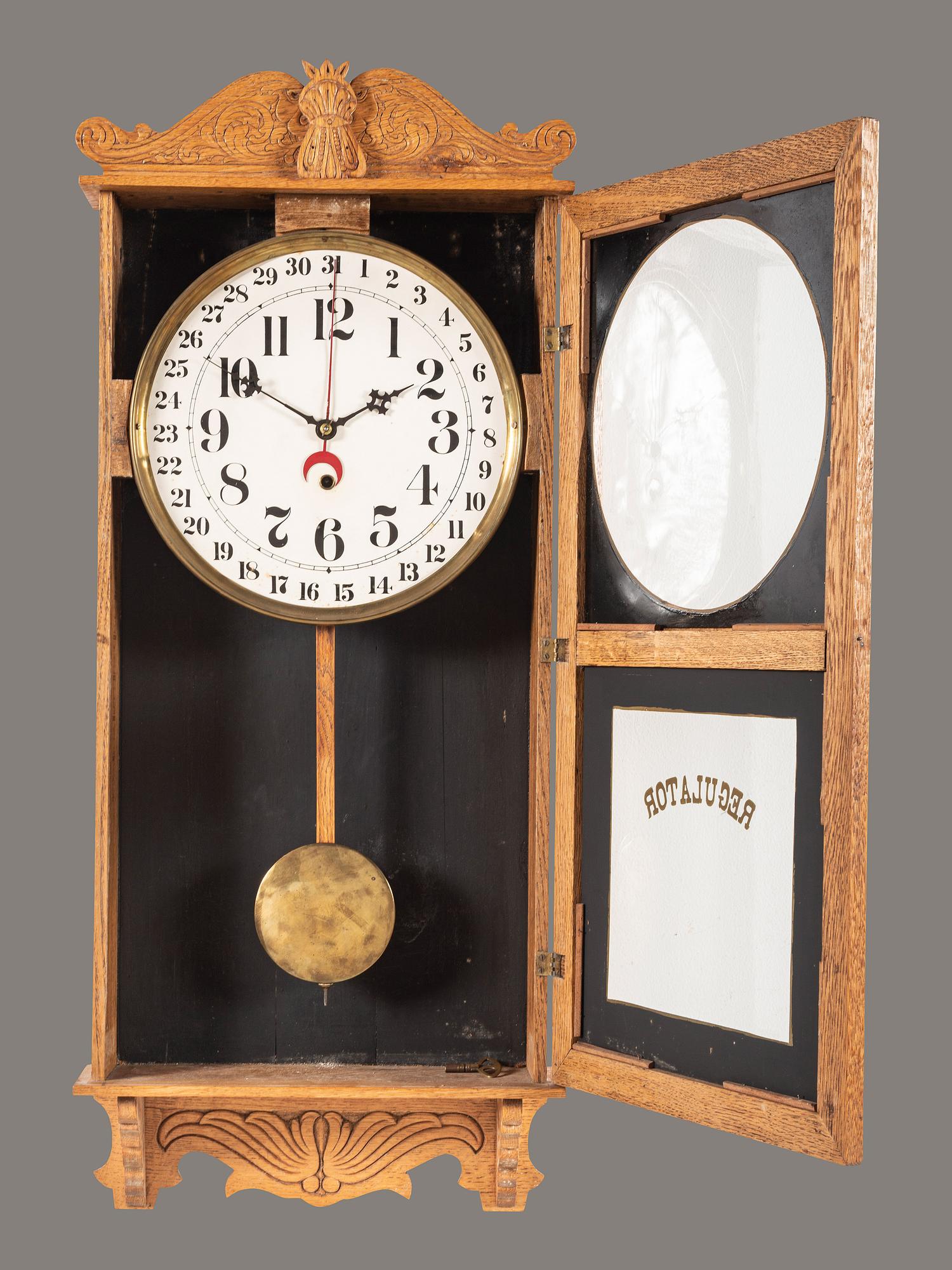 A Victorian Carved Oak Regulator Wall-Clock