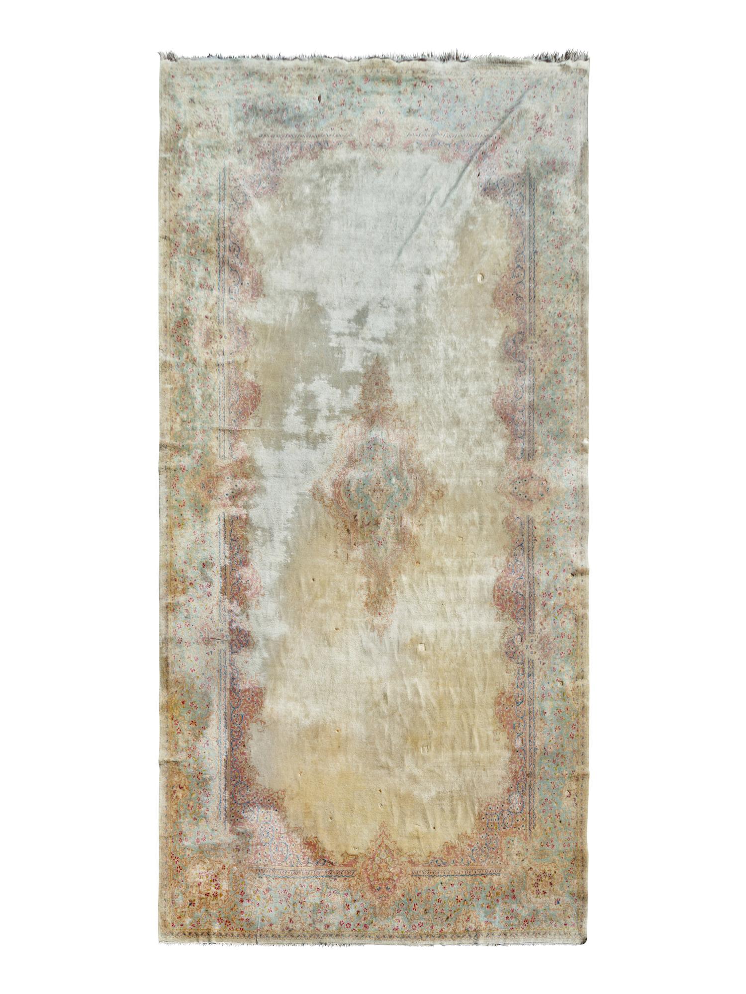 A Kerman Wool Rug — 20TH CENTURY