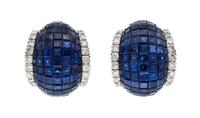 A Pair of 18 Karat White Gold and Invisibly Set Sapphire and Diamond Earclips, 14.90 dwts.