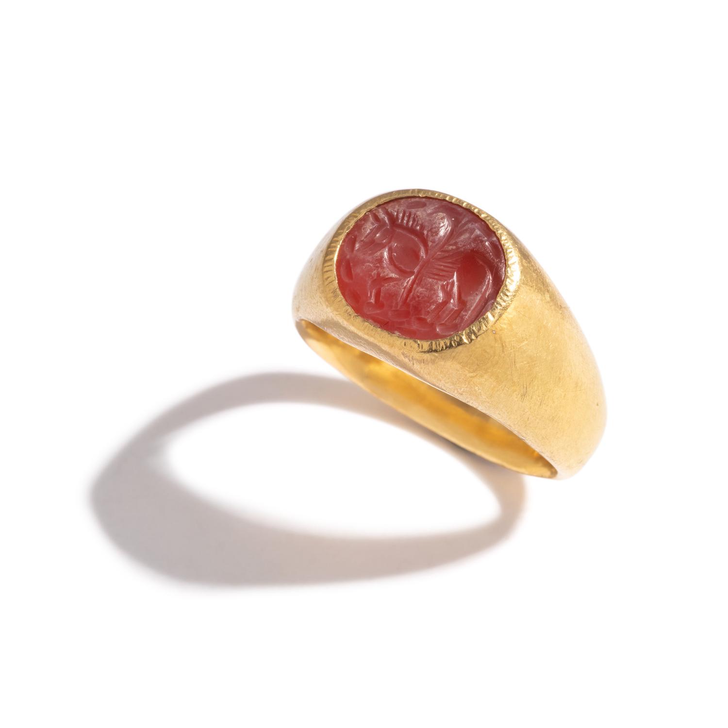 A Roman Gold and Carnelian Finger Ring with the Flying Horse Pegasus