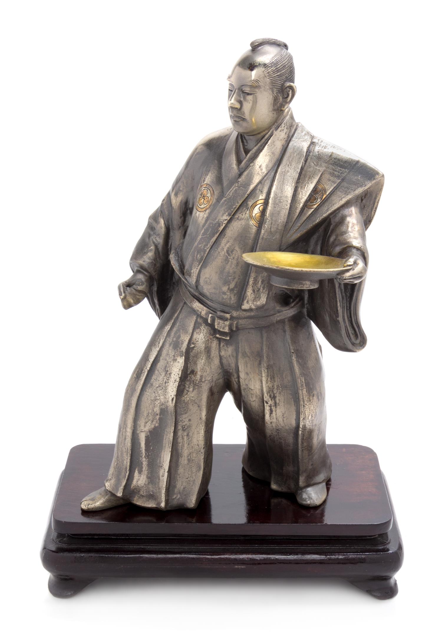 A Silvered Metal Figure of a Samurai Height 12 1/2 inches. — 19TH CENTURY