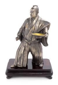 A Silvered Metal Figure of a Samurai Height 12 1/2 inches. — 19TH CENTURY
