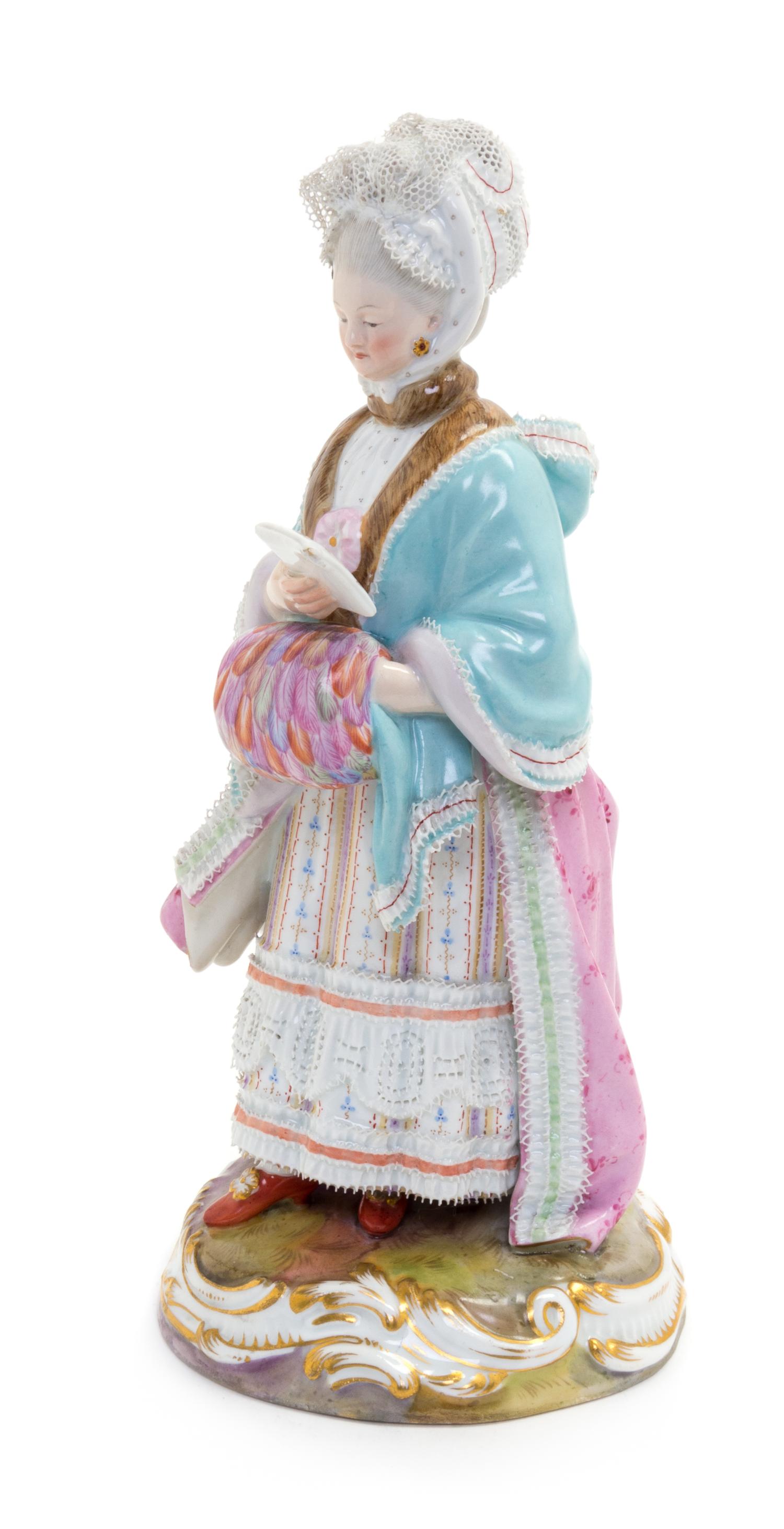 A Meissen Porcelain Figure of a Lady with a Muff Height 8 inches. — LATE 19TH/EARLY 20TH CENTURY