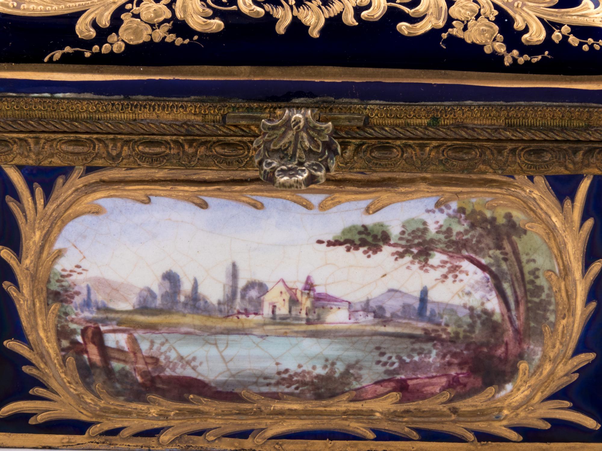 A Sèvres Style Gilt Metal Mounted, Painted and Parcel Gilt Porcelain Table Casket