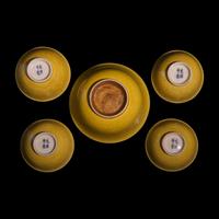 A Group of Five Chinese Incised Yellow Glazed Porcelain "Dragon" Bowls, 19th/20th Century — 清晚期 黃釉暗刻龍紋碗一組五件