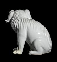 A Japanese Hirado White Glazed Porcelain Figure of a Puppy
