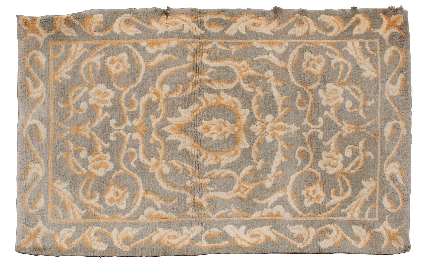 A Wool Rug — 20TH CENTURY