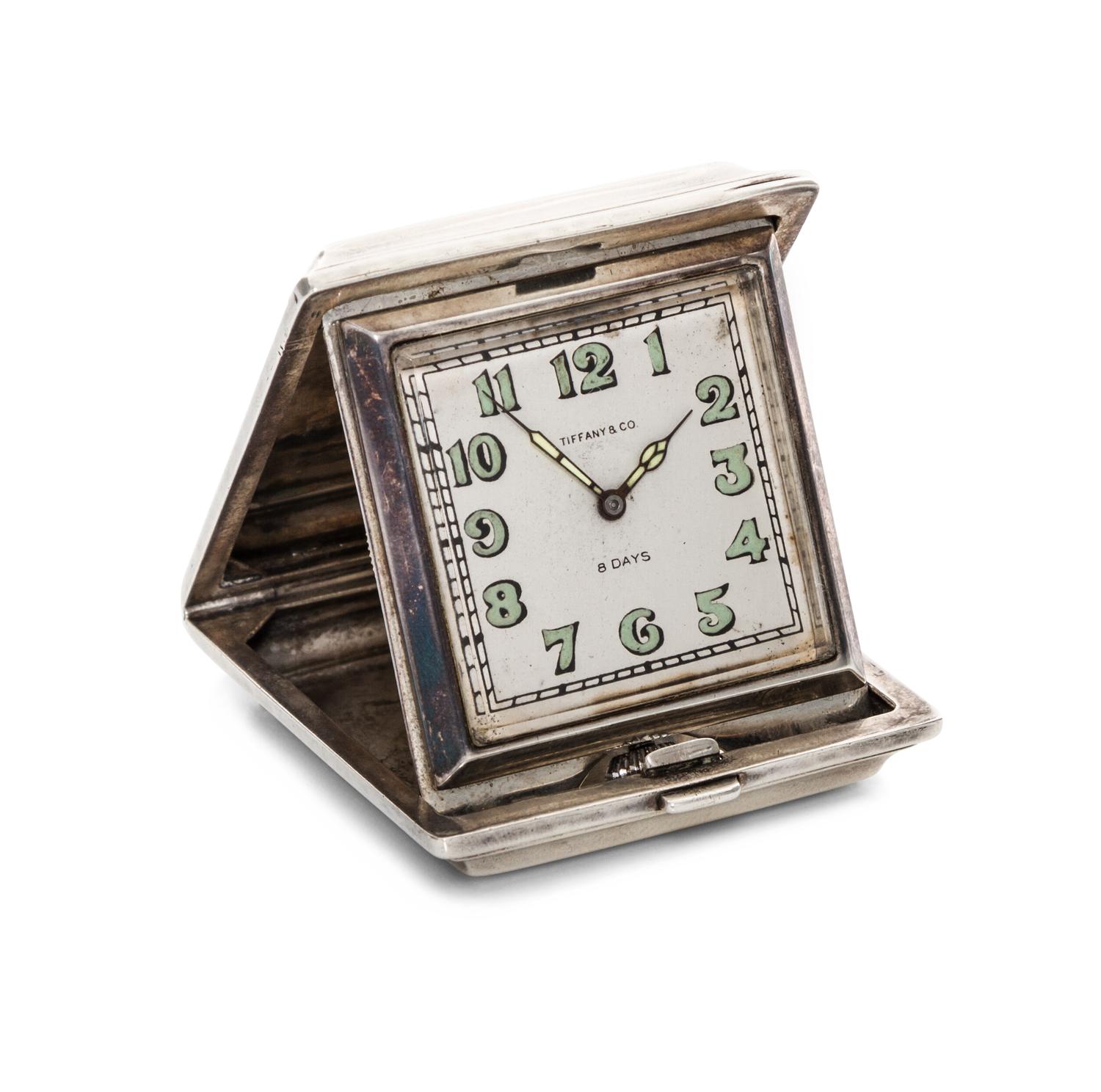 An American Silver Travel Clock, Tiffany & Co., New York, NY, Circa 1920s, of rectangular form with spot-hammered surfaces, the exterio