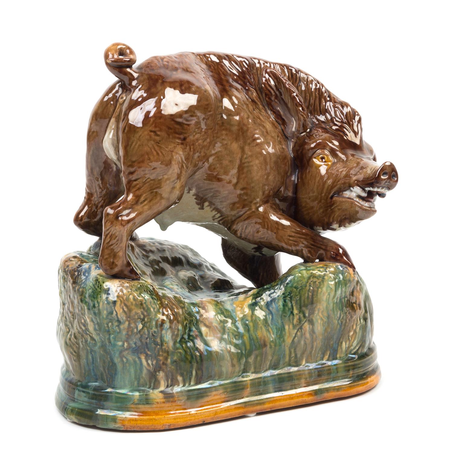 A Portuguese Majolica Figure of a Wild Boar Height 10 1/2 x width 10 inches. — 19TH CENTURY