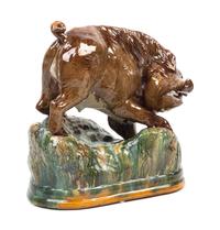 A Portuguese Majolica Figure of a Wild Boar Height 10 1/2 x width 10 inches. — 19TH CENTURY